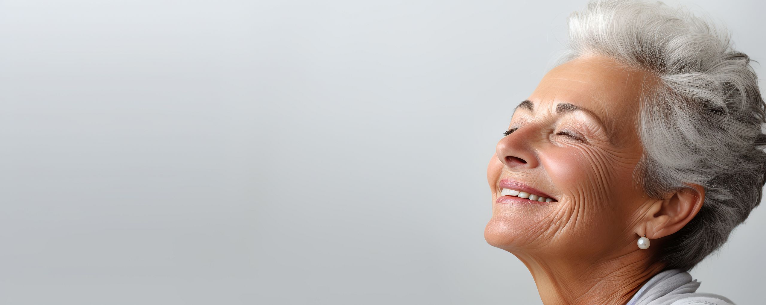 A smiling elderly woman enjoying a moment of joy
